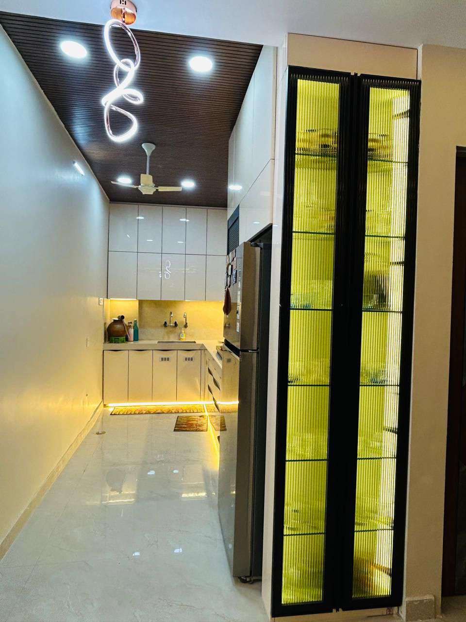 Backlit reeded glass display cabinet, floor to ceiling